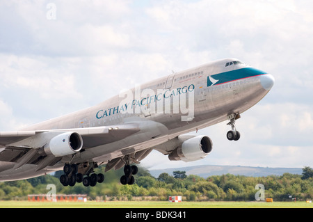 Boeing 747-412BCF B-HKS in the livery of Cathay Pacific Cargo takes off from Manchester Airport Stock Photo