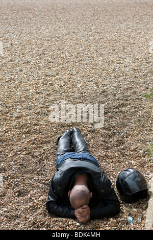 Biker on Brighton beach. Stock Photo