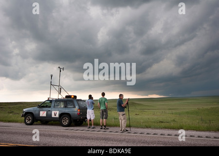 Storm chasers with Project Vortex 2 watch a distant supercell in Goshen County, Wyoming, June 5, 2009. Stock Photo