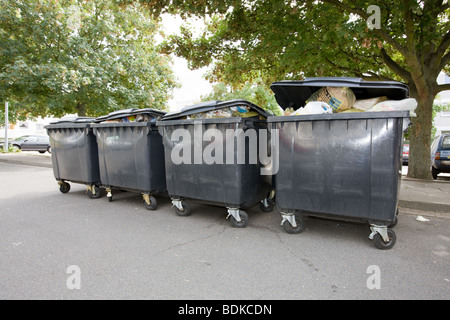 Full household waste wheelie bins and rubbish Stock Photo - Alamy