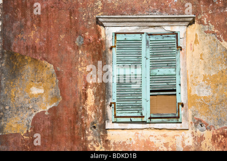 The run down facade of the former Governors House on the harbourside in Gaios, Paxos Island, Ionian Sea, Greece Stock Photo