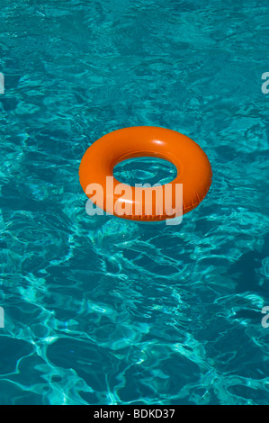 inflatable play pool rubber ring colorful colourful cool float floating fun heat holiday relax relaxation resort ring rubber Stock Photo