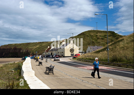 Woman Walking Along Saltburn Sea Front Stock Photo