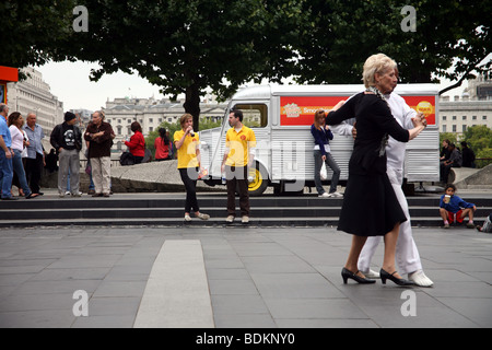 Glamorous mixed race elderly couple dancing in the foyer at The Royal Festival hall South Bank London Stock Photo