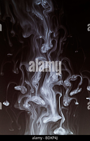 turbulent flow demonstrated by squirting ink in water Stock Photo