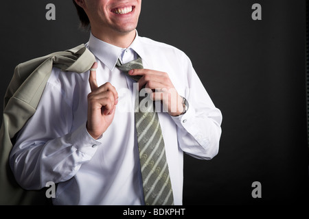 young resting businessman. taking of the necktie Stock Photo
