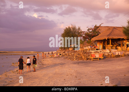 Indonesia, Lombok, Gili Air, north coast, sunset point, people gathering to enjoy setting sun Stock Photo