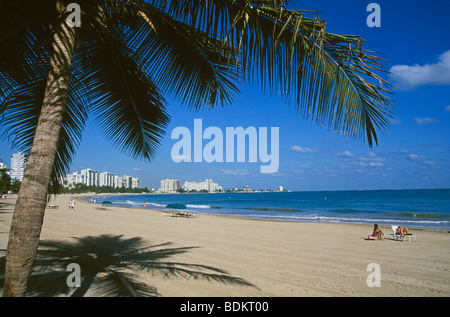 San Juan Puerto Rico Isla Verde beach with sunbathers, blue sky and ...