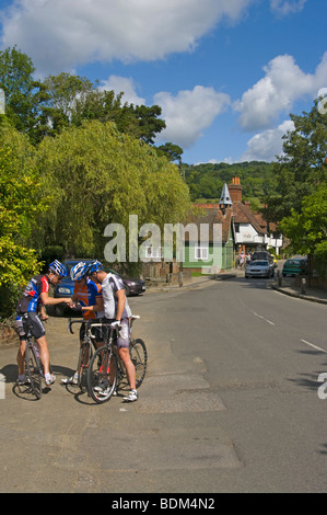 Shere Map Three Cyclists Studying a Map Stock Photo - Alamy
