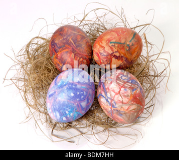 Easter Eggs in a straw nest Stock Photo