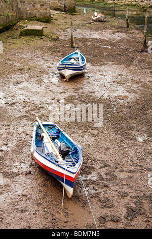 Staithes Beck, coble boats in the estuary of the small fishing village of Staithes, North Yorkshire, England, UK Stock Photo