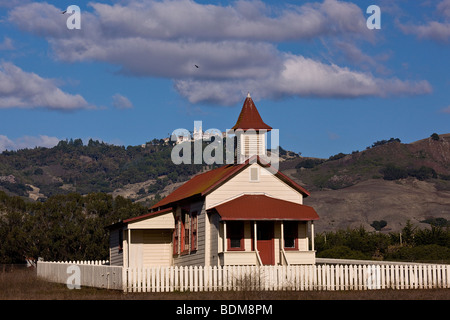 An old abandoned school house sits below Hearst Castle in the small enclave of San Simeon, California, USA. Stock Photo