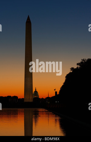 View of Washington Monument and Reflecting Pool with Capitol Hill in Background at Sunrise. Stock Photo