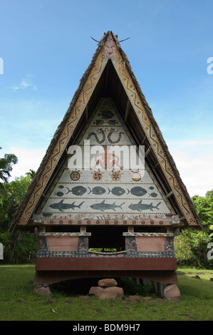 A men's house with decorative paintings on the front in Palau. Stock Photo