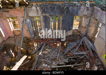 Interior of ruined stone built house destroyed in 1953 earthquake disaster on the Greek island of Kefalonia Greece GR Stock Photo