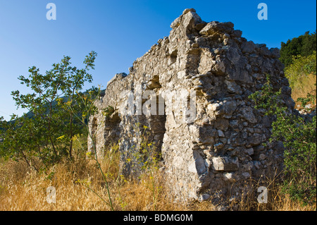 Exterior of ruined stone built house destroyed in 1953 earthquake disaster on the Greek island of Kefalonia Greece GR Stock Photo