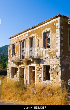 Exterior of ruined stone built house destroyed in 1953 earthquake disaster on the Greek island of Kefalonia Greece GR Stock Photo