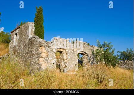 Exterior of ruined stone built house destroyed in 1953 earthquake disaster on the Greek island of Kefalonia Greece GR Stock Photo