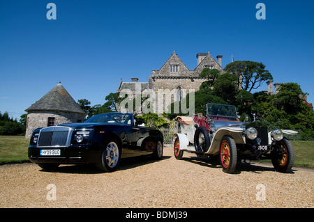 Rolls Royce Phantom drophead coupe 2009 and Rolls Royce Silver Ghost 1909 outside Palace House, Beaulieu Stock Photo