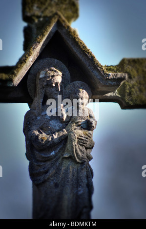 carving of mary and baby jesus in barsham churchyard Stock Photo