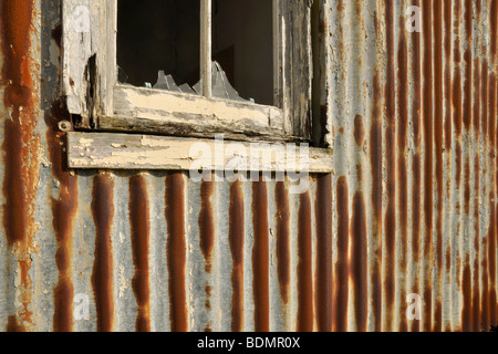 corrugated iron and broken window, abandoned croft, Scalpay Stock Photo