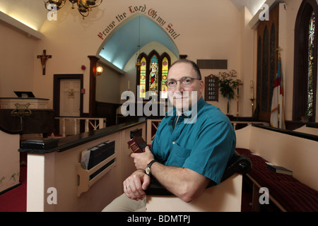 Gay Parishioner worshipping in St. John's Episcopal Church-Wilmot, an all-inclusive LGBT-friendly church in New York. KAndriotis Stock Photo