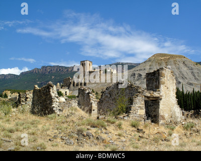 The ruins of the village of Esco in northern Spain, abandoned in 1959 when the valley below it was flooded to create the Embalse Stock Photo