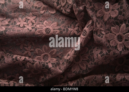 Embroidery sample. Floral design embroidered in white silk, silver thread  and wire, and silver sequins on a brown ground Stock Photo - Alamy