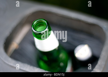 Close up of a bottle that has been placed in a recycling bin at a recycling center. Stock Photo