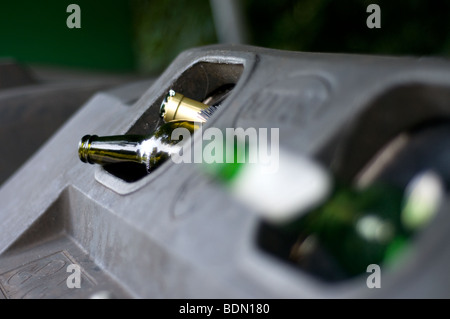 View of the top of a full recycling bin with bottle coming out of the top with intentional depth of field Stock Photo