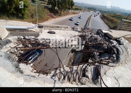 A bridge damaged by Israeli bombings in 2006, overlooking a highway south of Beirut. Stock Photo