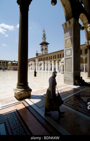 Veiled women walk in the courtyard of the Umayyad Mosque (Grand Mosque of Damascus). Stock Photo