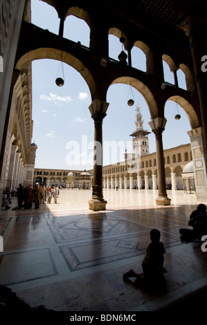 Children and families in the courtyard of the Umayyad Mosque (Grand Mosque of Damascus). Stock Photo