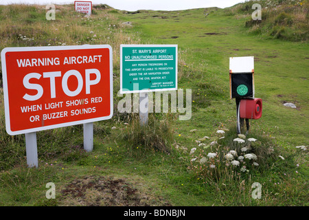 Warning signs on approach to the runway at St. Mary's airport on the island of St. Mary's, Scilly Isles Stock Photo