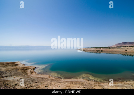 Mineral deposits ring the eastern shore of the Dead Sea in Jordan. Stock Photo