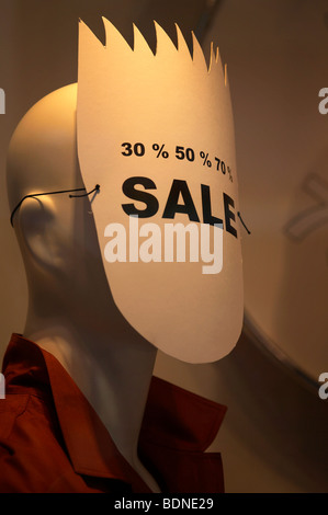 Window dummy, poster covering her face, advertising for sale Stock Photo