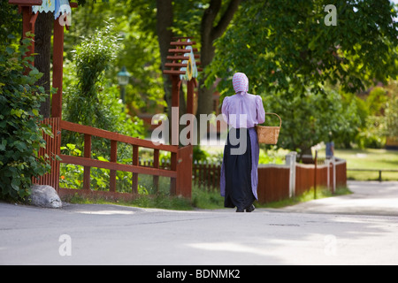 Woman in traditional dress in Skansen Open Air Museum, Stockholm, Sweden Stock Photo
