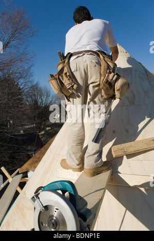 Carpenter working on the turret of a house Stock Photo