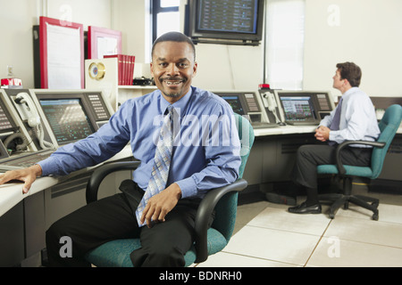 Two operating engineers in a control room Stock Photo