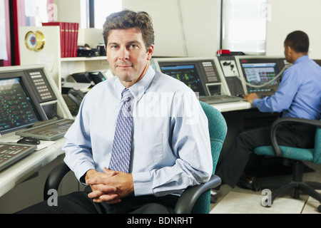 Two operating engineers in a control room Stock Photo