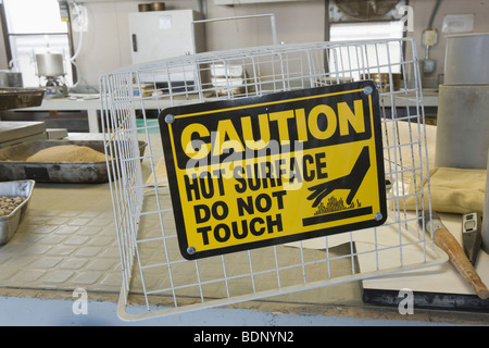 Warning sign in an asphalt plant laboratory Stock Photo