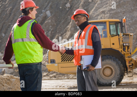 Two engineers shaking hands Stock Photo