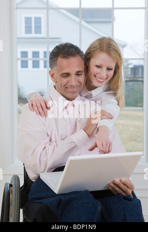 Couple working on a laptop Stock Photo