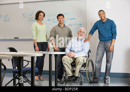 University professor with his students in a classroom Stock Photo