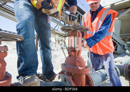 Two engineers working at a plant Stock Photo