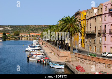 Boats on the river Temo and the historic town centre of Bosa, palm trees along the promenade, Bosa, Oristano, Sardinia, Italy,  Stock Photo