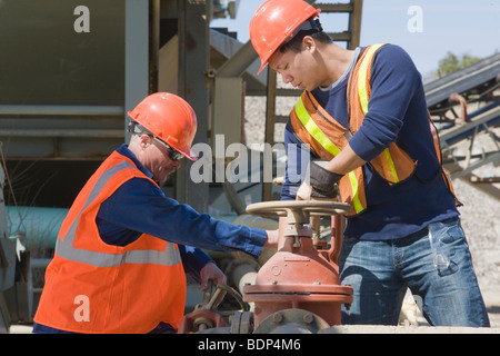 Two engineers working at a plant Stock Photo