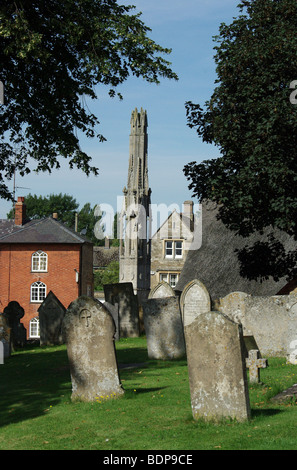 Queen Eleanor Cross taken from the church of St Mary Magdalene, Geddington, Northamptonshire, UK Stock Photo