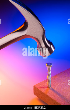 Hammer and screw, wrong tool for the job Stock Photo
