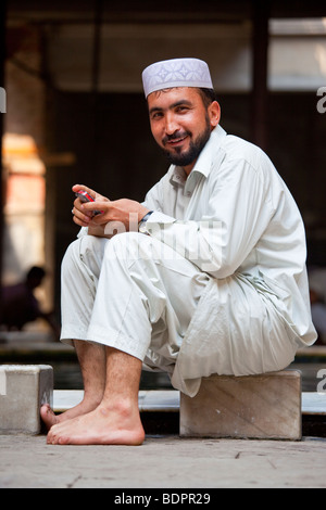 Muslim Man at Ablution Pool in Nakhoda Mosque in Calcutta India Stock Photo